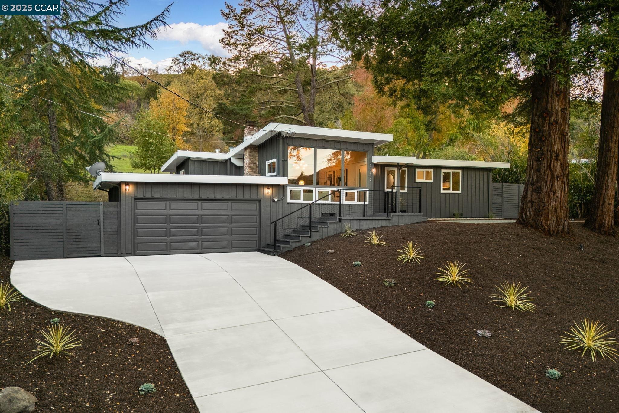 a view of house with a yard