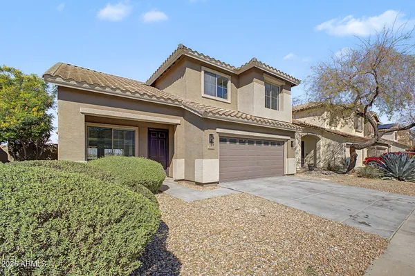 front view of a house with a dry yard