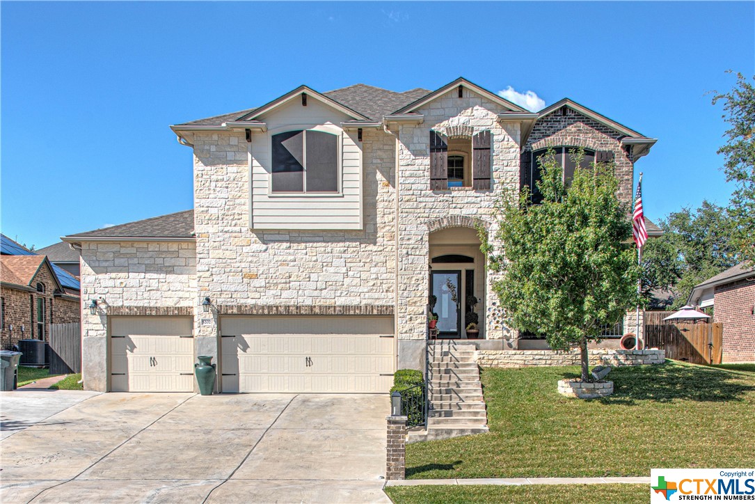 5202 Siltstone Loop Killeen, TX 76542 - Photo 1 of 1 a front view of a house with garden