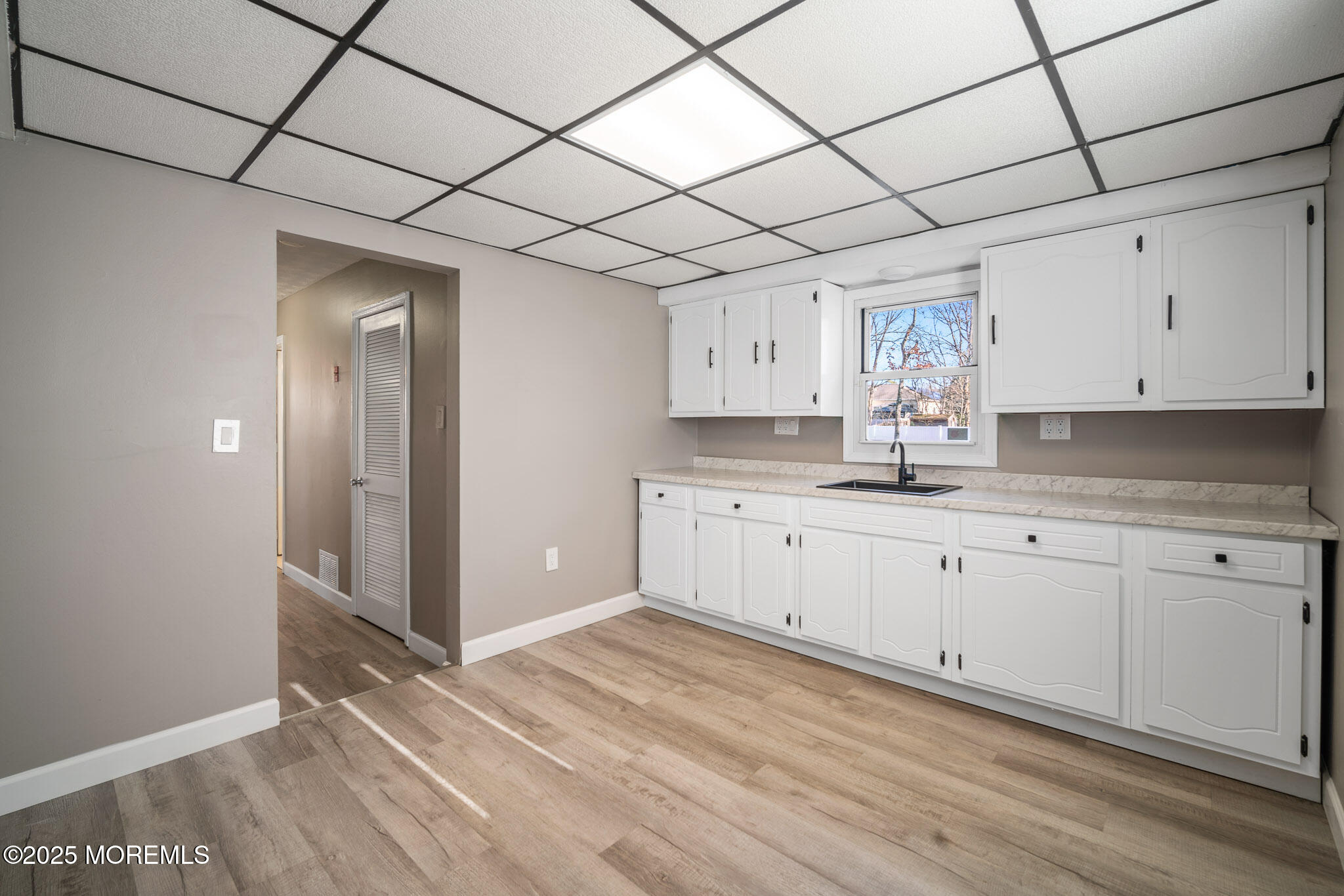 12 6th Street Barnegat, NJ 08005 - Photo 15 of 31 a kitchen with granite countertop white cabinets and white appliances