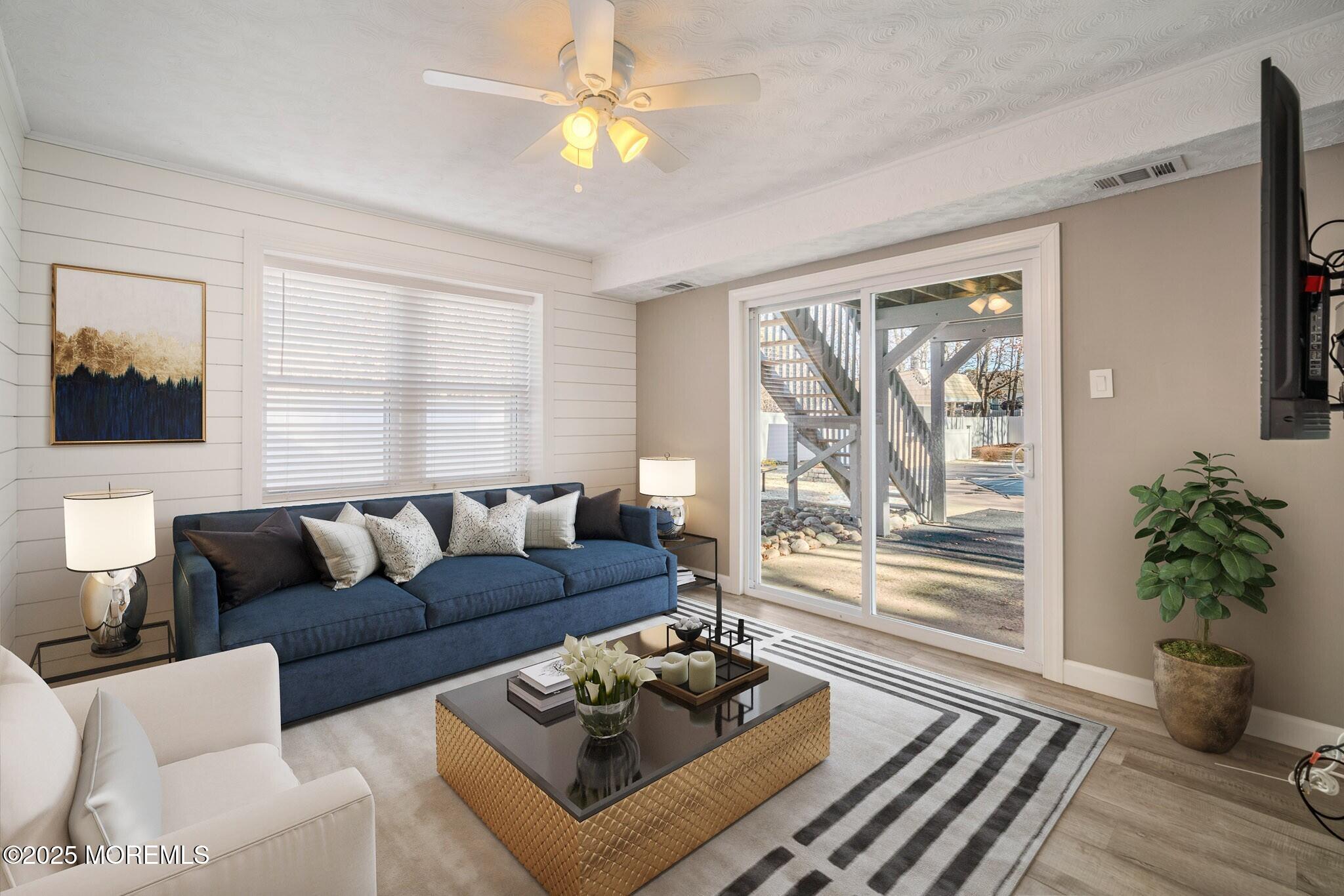 12 6th Street Barnegat, NJ 08005 - Photo 17 of 31 a living room with furniture and a large window