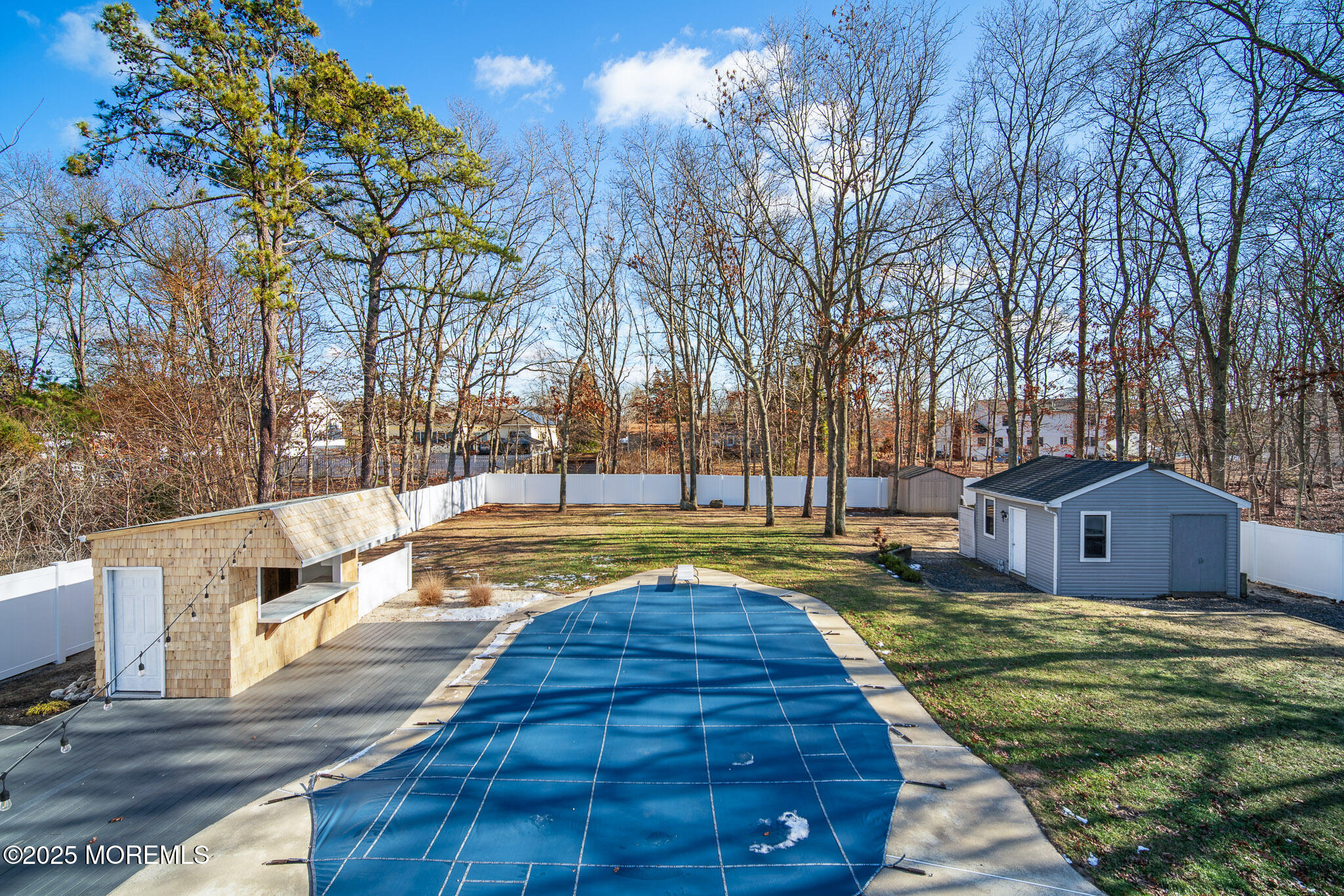 12 6th Street Barnegat, NJ 08005 - Photo 22 of 31 a view of swimming pool with trees and wooden fence