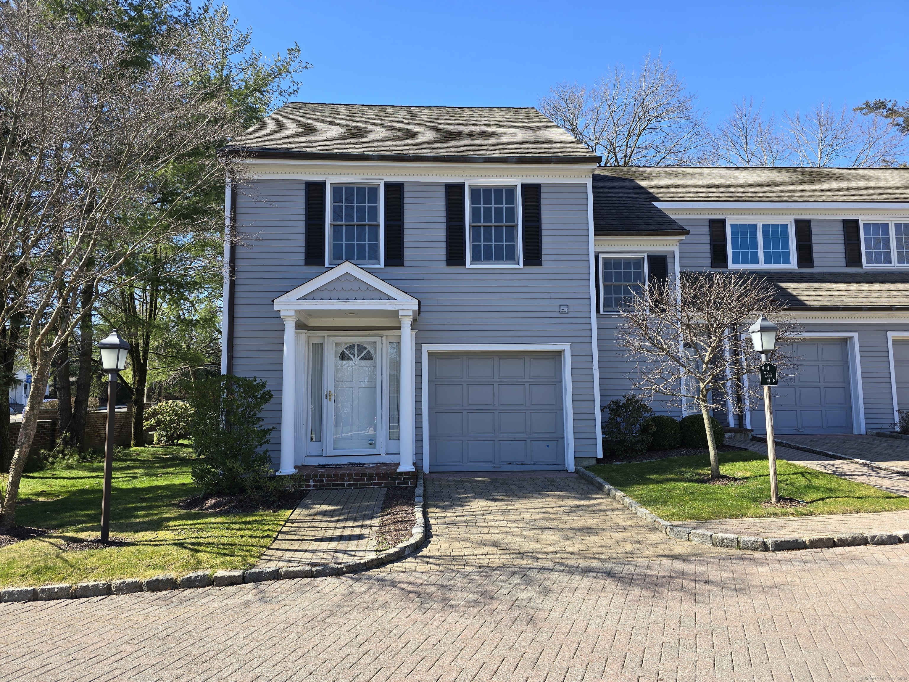4 Ward Lane, Unit 4 Darien, CT 06820 - Photo 1 of 1 a front view of a house with garden