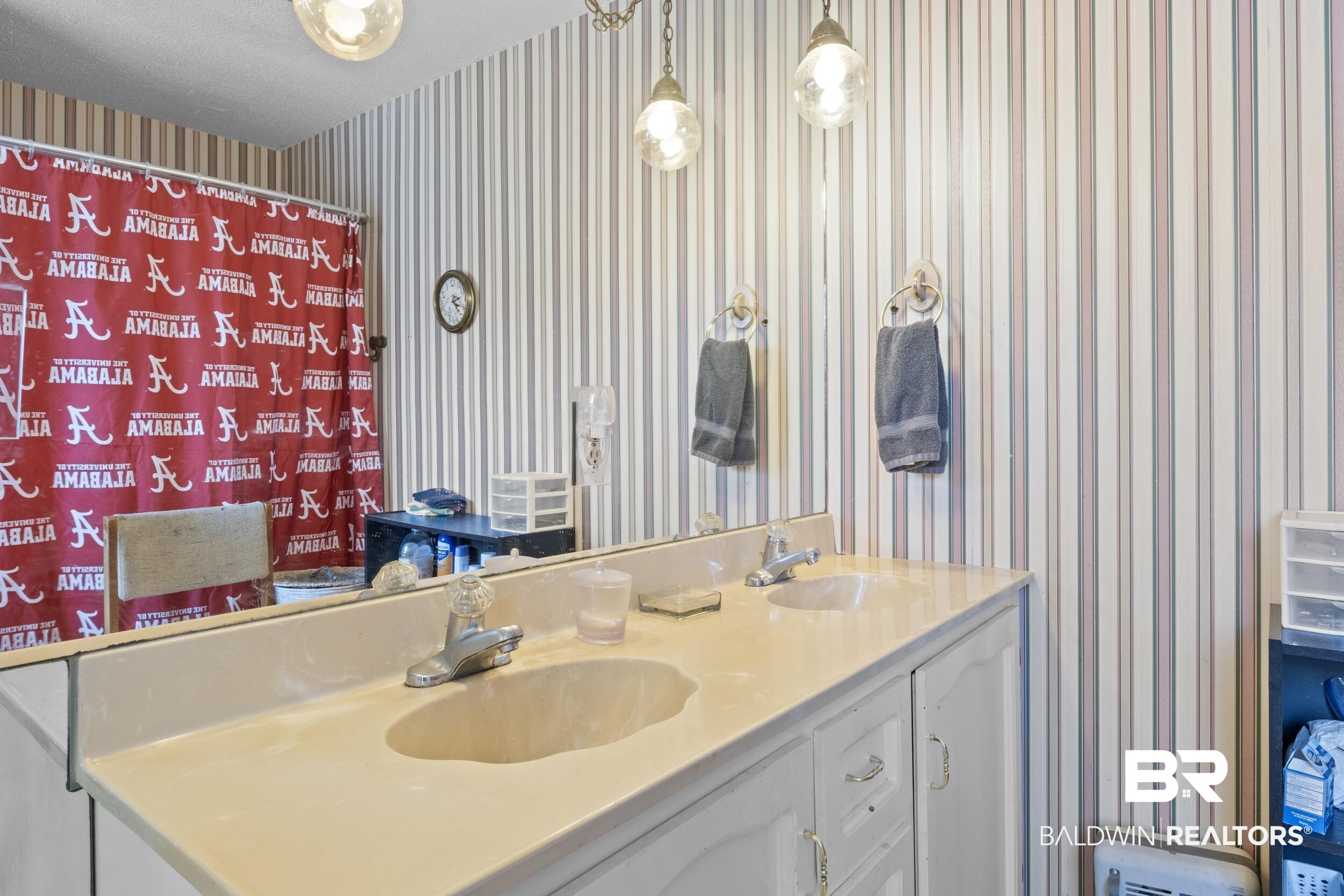 8701 A Rosemary Road Eight Mile, AL 36613 - Photo 18 of 27 Bathroom featuring dual bowl vanity