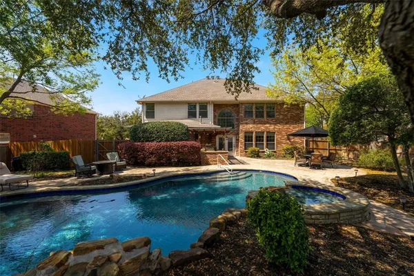 a small pool with outdoor seating