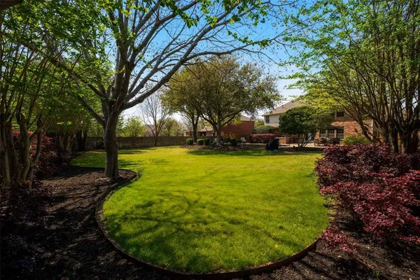 a view of swimming pool with a yard and sitting area