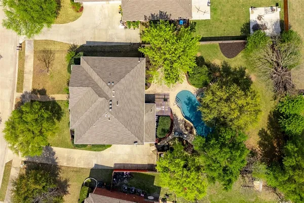 an aerial view of a house with a lake view