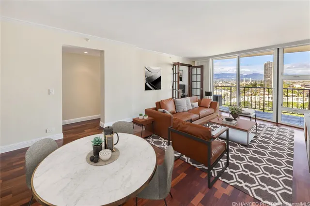 a living room with furniture and wooden floor