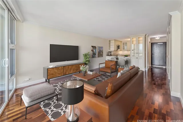 a living room with furniture and a flat screen tv