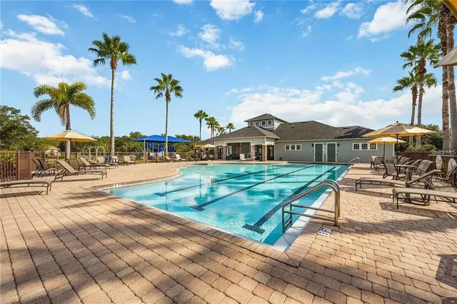 a view of a house with outdoor space and sitting area