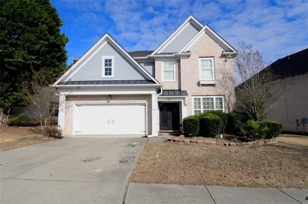 a view of a house with a yard