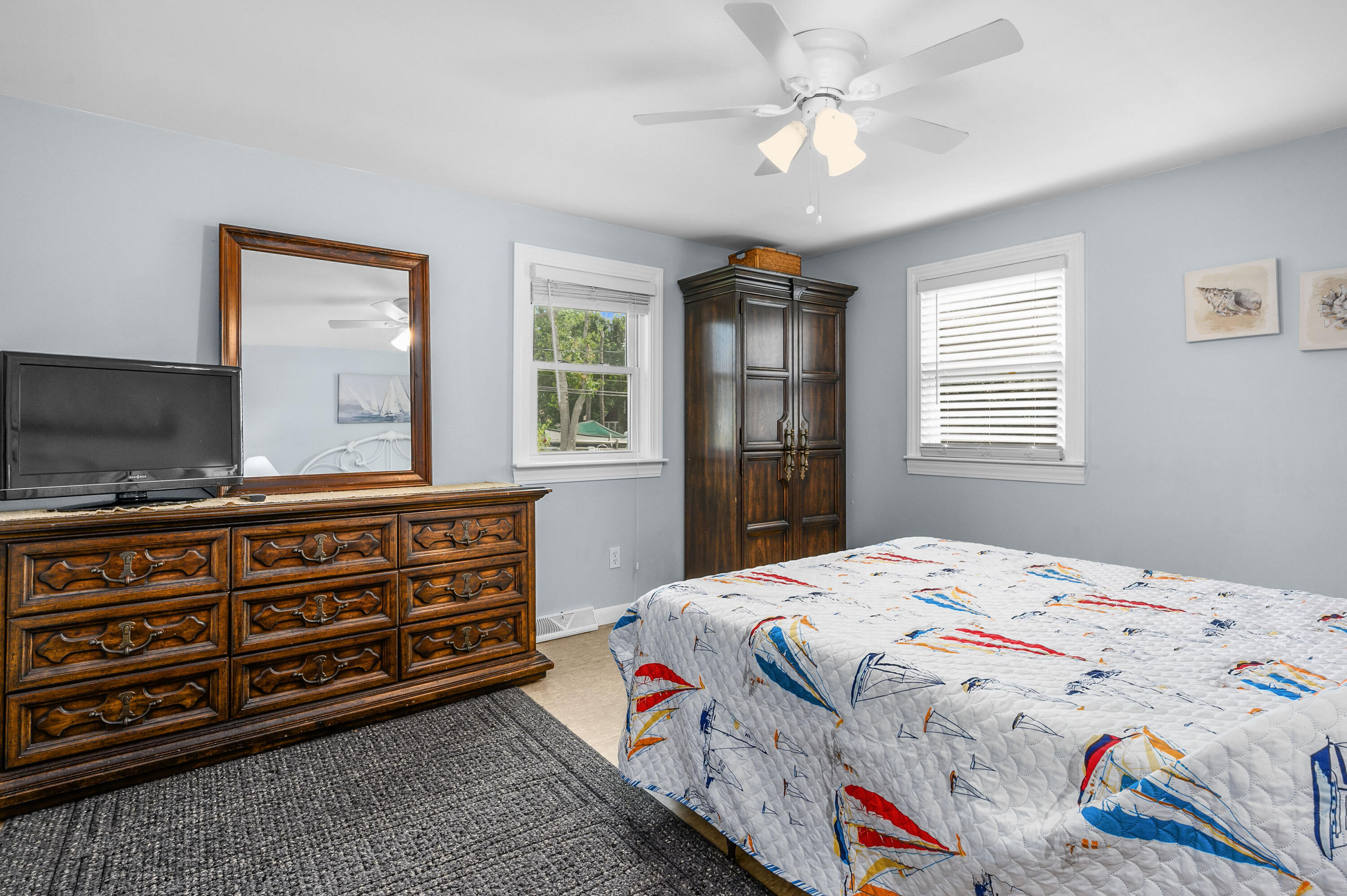 25 Pine Cone Drive West Yarmouth, MA 02673 - Photo 13 of 34 a bedroom with a bed and a dresser in it