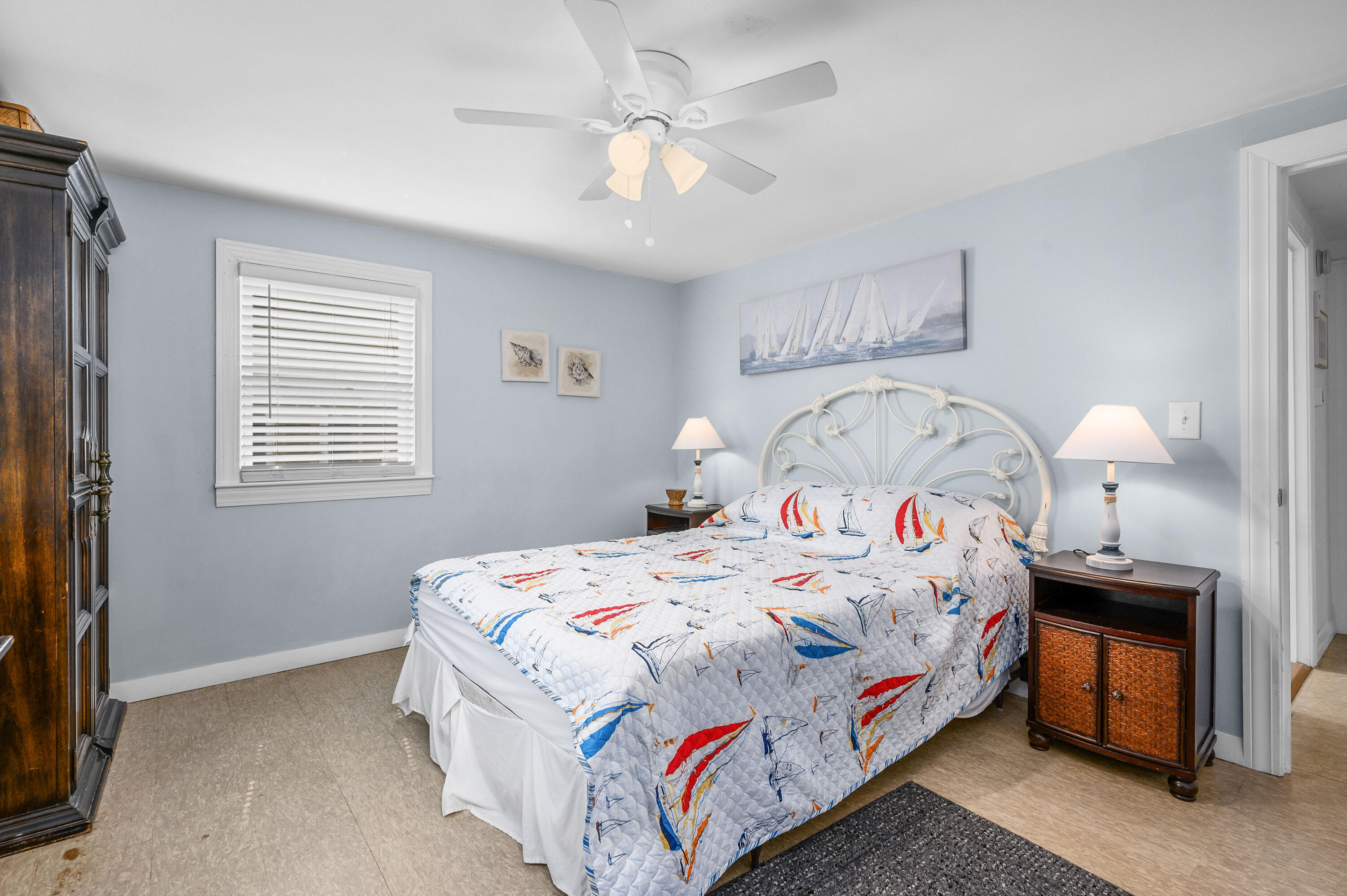 25 Pine Cone Drive West Yarmouth, MA 02673 - Photo 14 of 34 a bedroom with bed and a chandelier