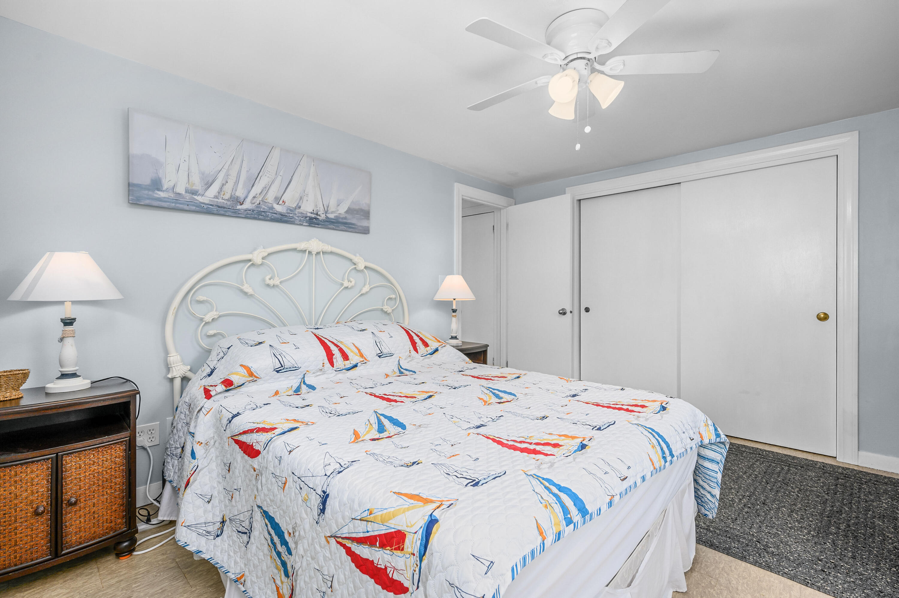 25 Pine Cone Drive West Yarmouth, MA 02673 - Photo 15 of 34 a bedroom with a bed and a chandelier