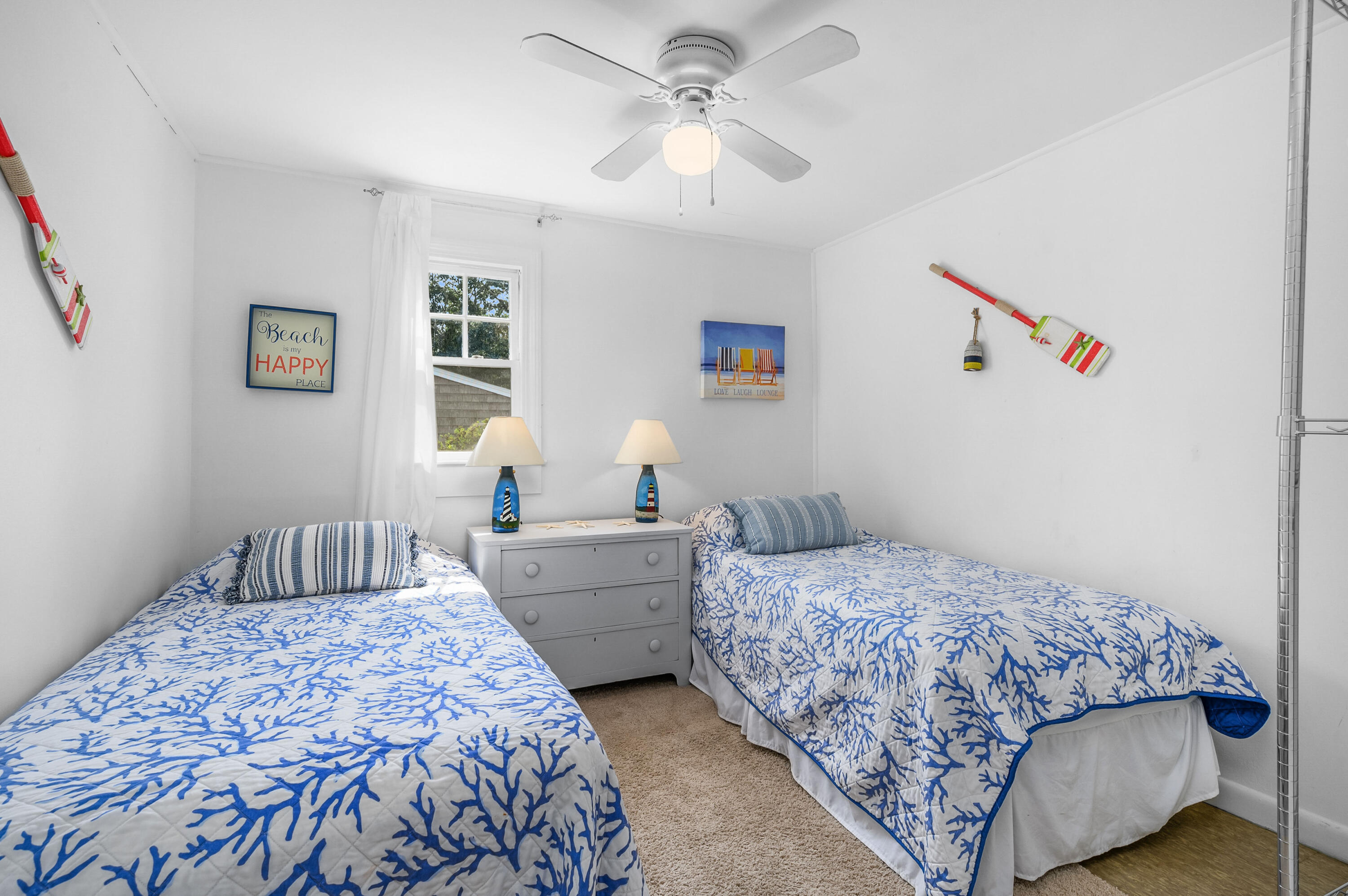 25 Pine Cone Drive West Yarmouth, MA 02673 - Photo 16 of 34 a bedroom with a bed and a chandelier