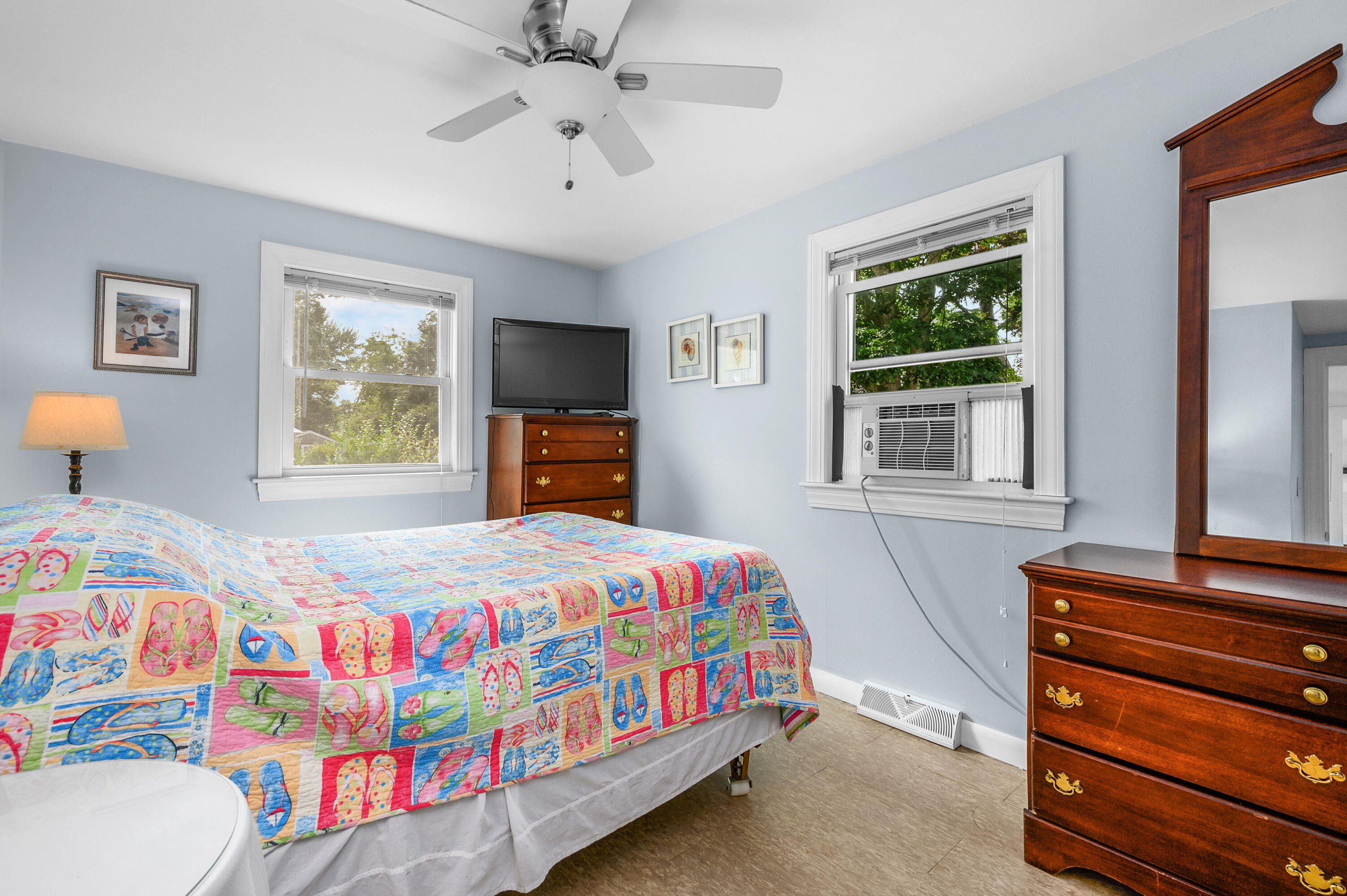 25 Pine Cone Drive West Yarmouth, MA 02673 - Photo 17 of 34 a bedroom with a bed and a dresser