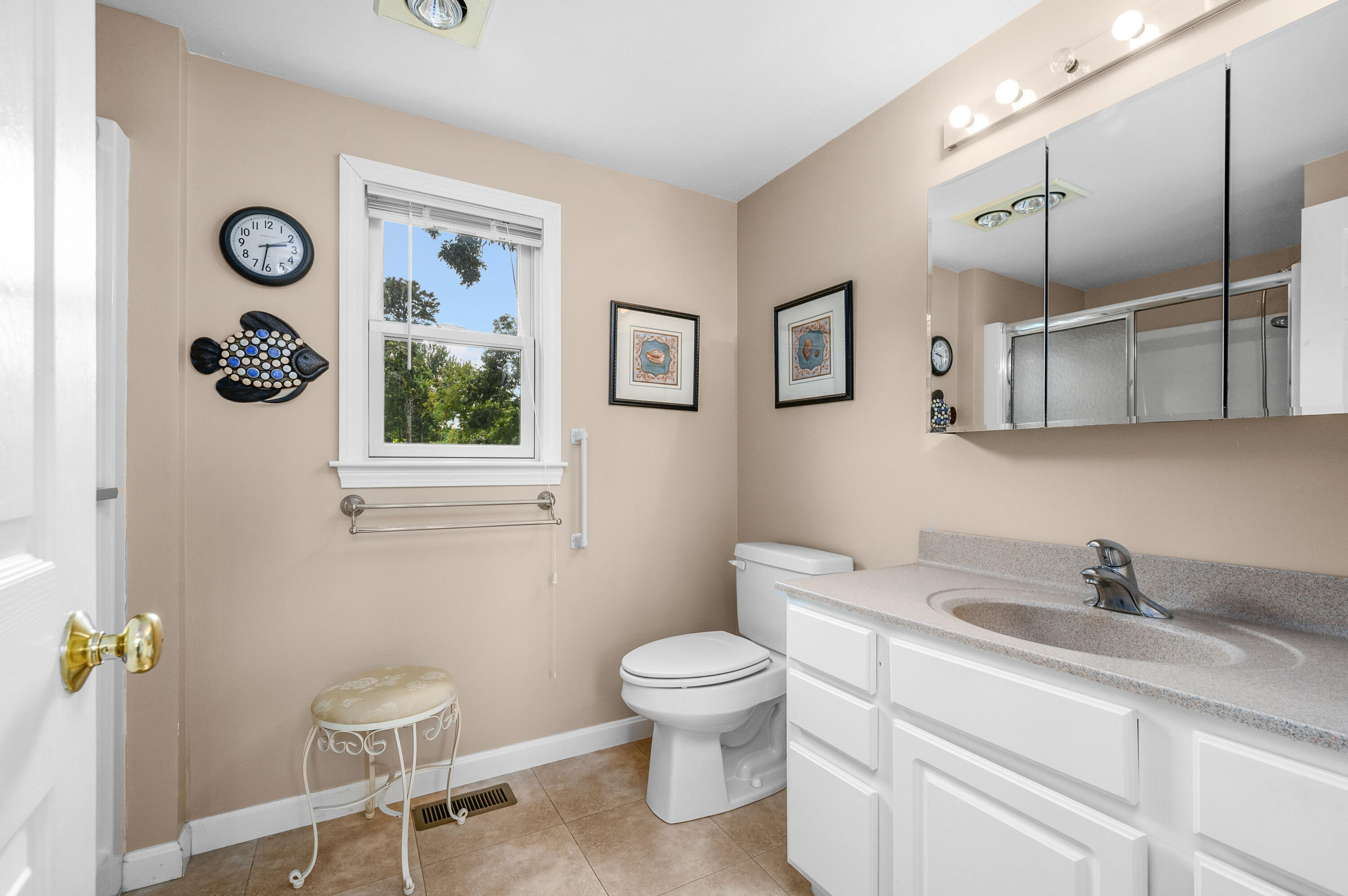 25 Pine Cone Drive West Yarmouth, MA 02673 - Photo 21 of 34 a bathroom with a toilet sink and mirror