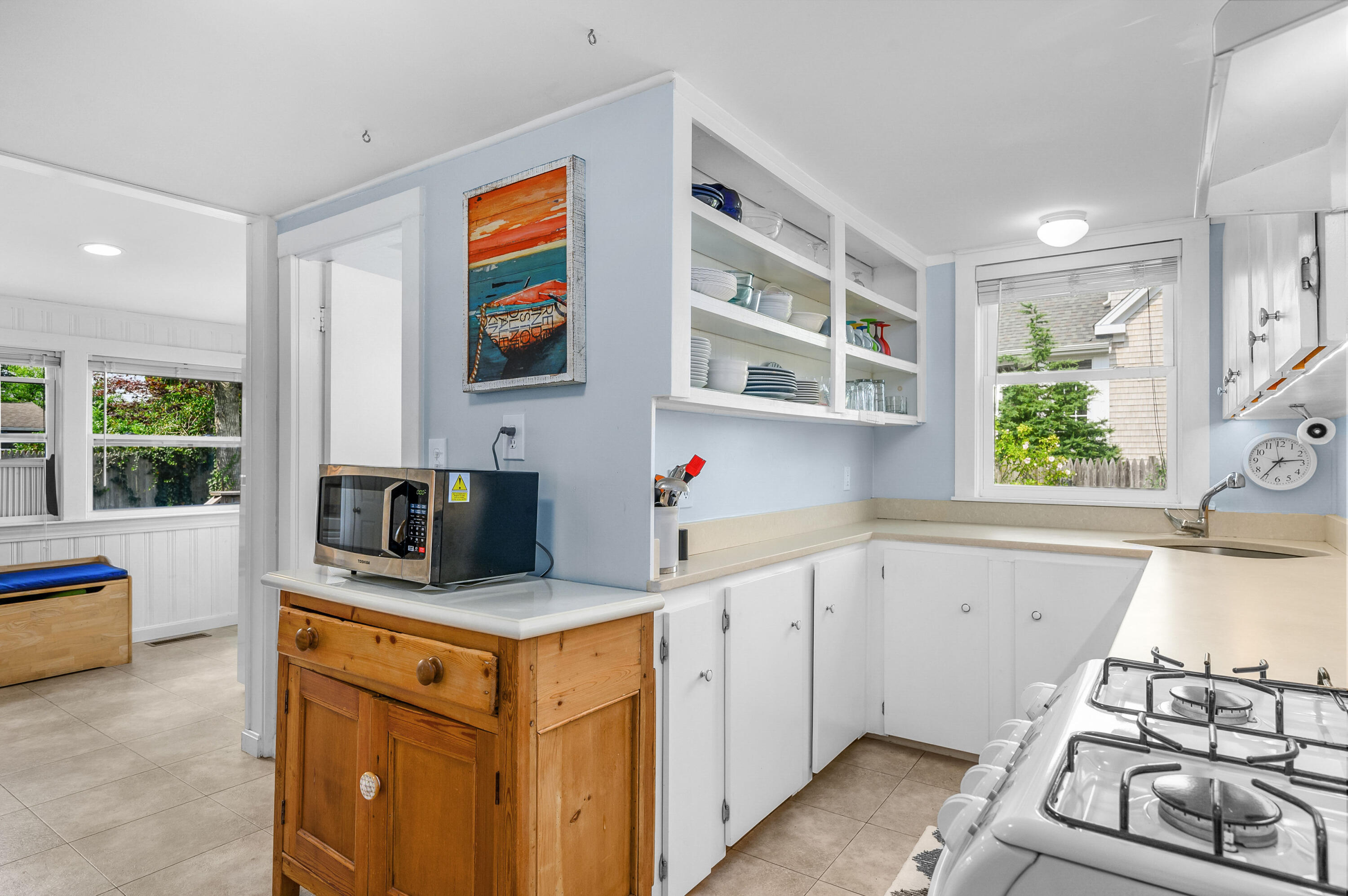 25 Pine Cone Drive West Yarmouth, MA 02673 - Photo 9 of 34 a kitchen with stainless steel appliances granite countertop a stove and a sink
