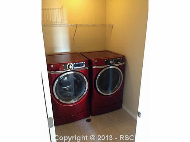 2464 Reed Grass Way Colorado Springs, CO 80915 - Photo 5 of 11 Laundry room with new front loading washer and dryer included