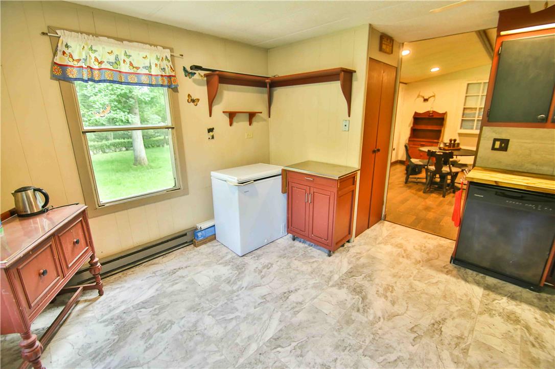 8 Cross Rds Drive Jim Thorpe, PA 18229 - Photo 9 of 32 Bright and functional, this kitchen space offers ample natural light and an extra freezer.