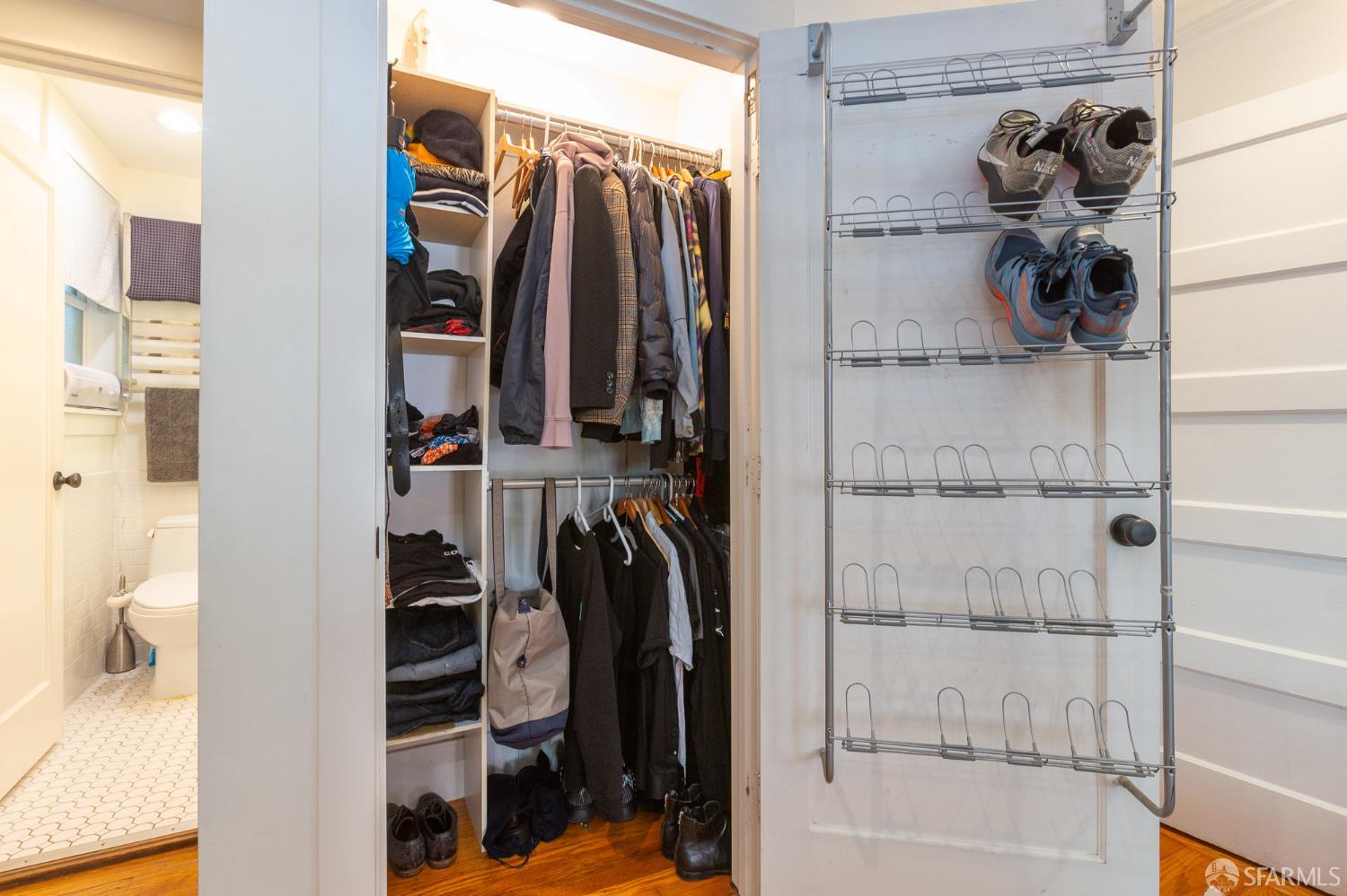 863 Haight Street, Unit 5 San Francisco, CA 94117 - Photo 7 of 16 a view of walk in closet with clothes and shoes