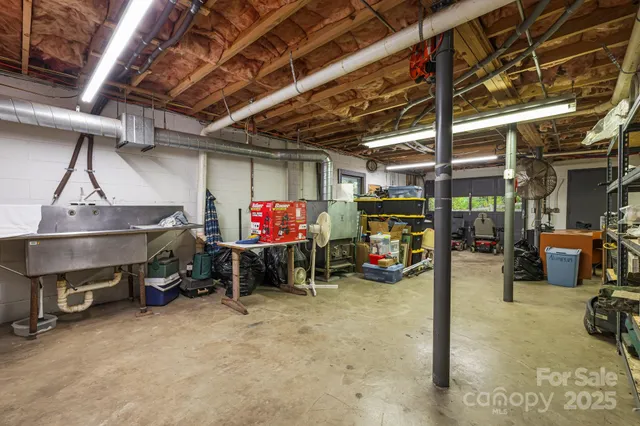 a view of a balcony with wooden floor and large trees
