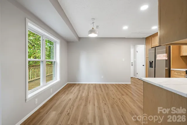 a kitchen with stainless steel appliances granite countertop a sink and a stove top oven