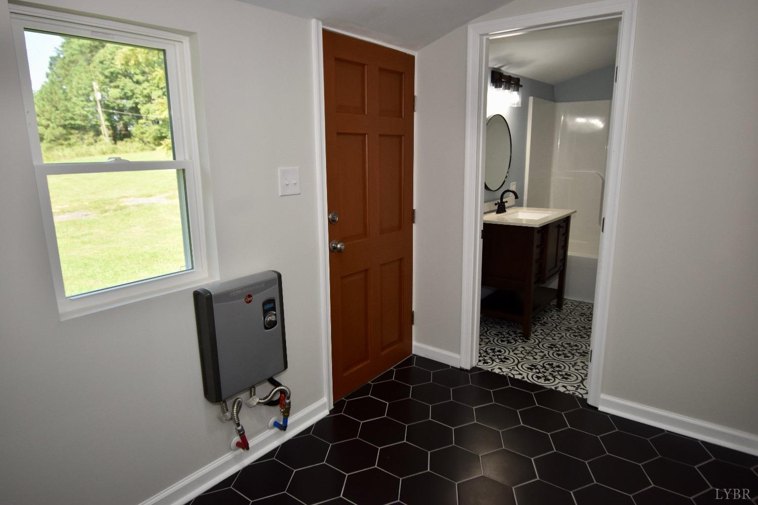 30 Sawmill Road Concord, VA 24538 - Photo 13 of 34 a bathroom with a sink and a mirror