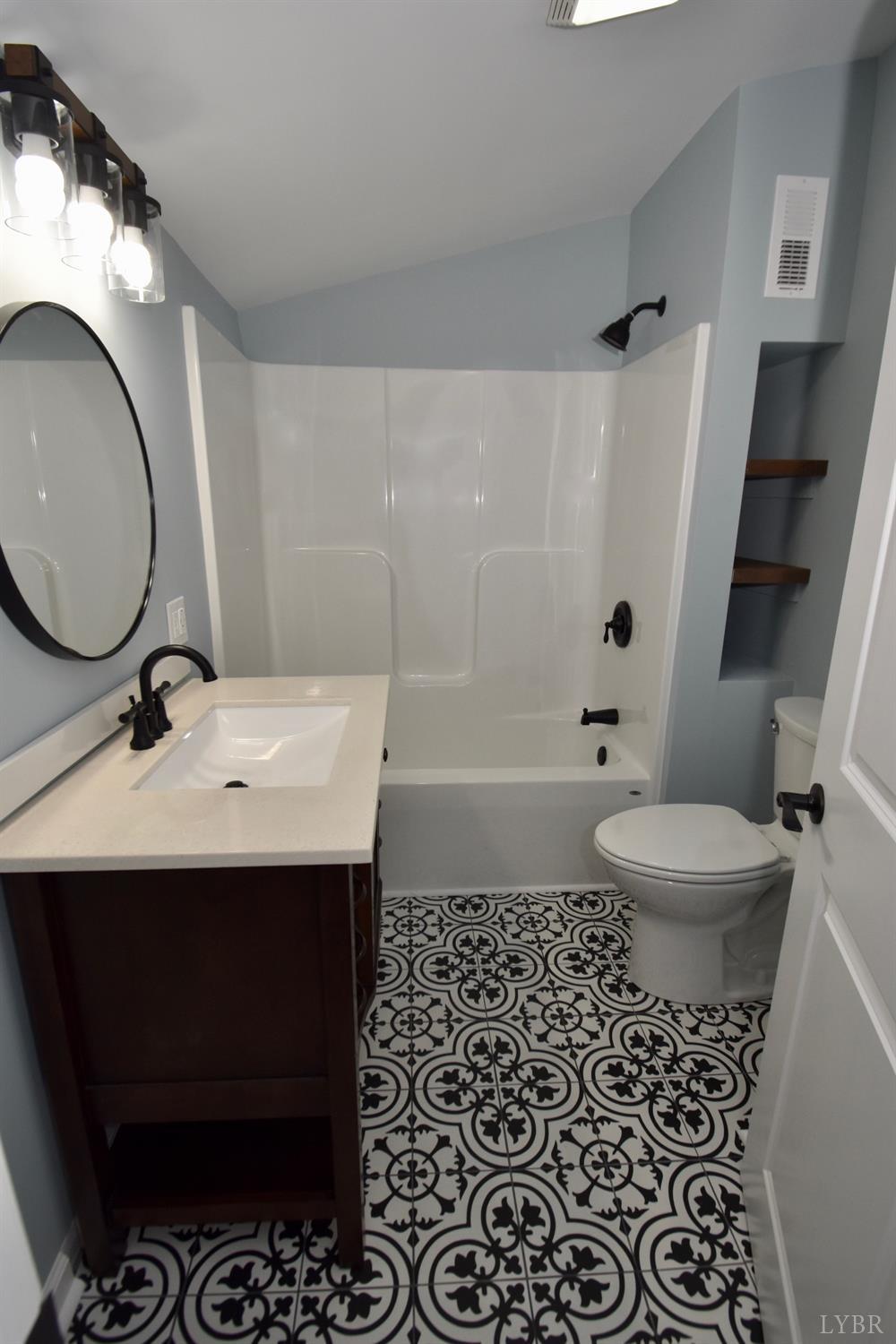 30 Sawmill Road Concord, VA 24538 - Photo 14 of 34 a bathroom with a sink toilet a mirror and shower