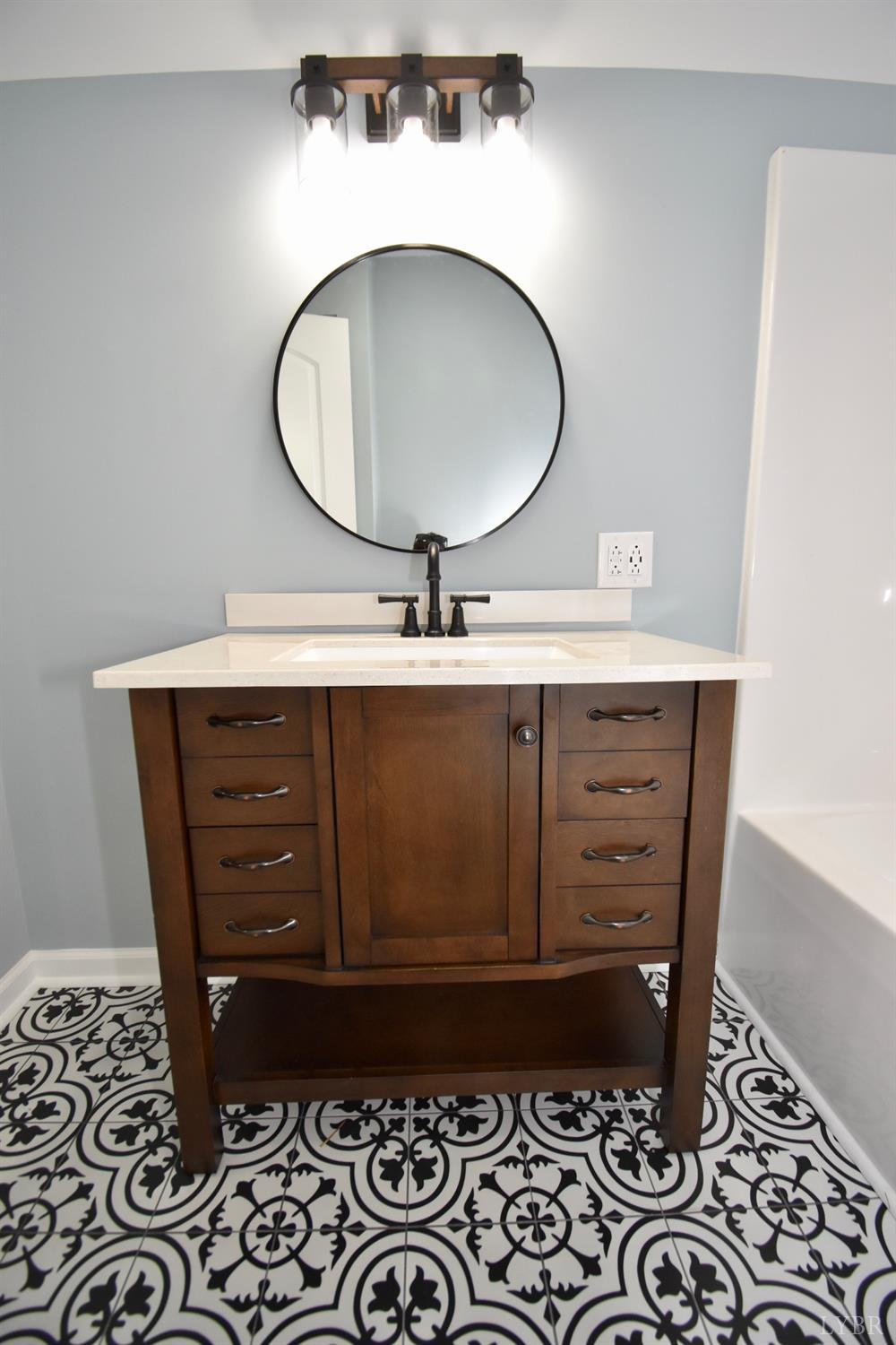 30 Sawmill Road Concord, VA 24538 - Photo 15 of 34 a bathroom with a sink and a mirror
