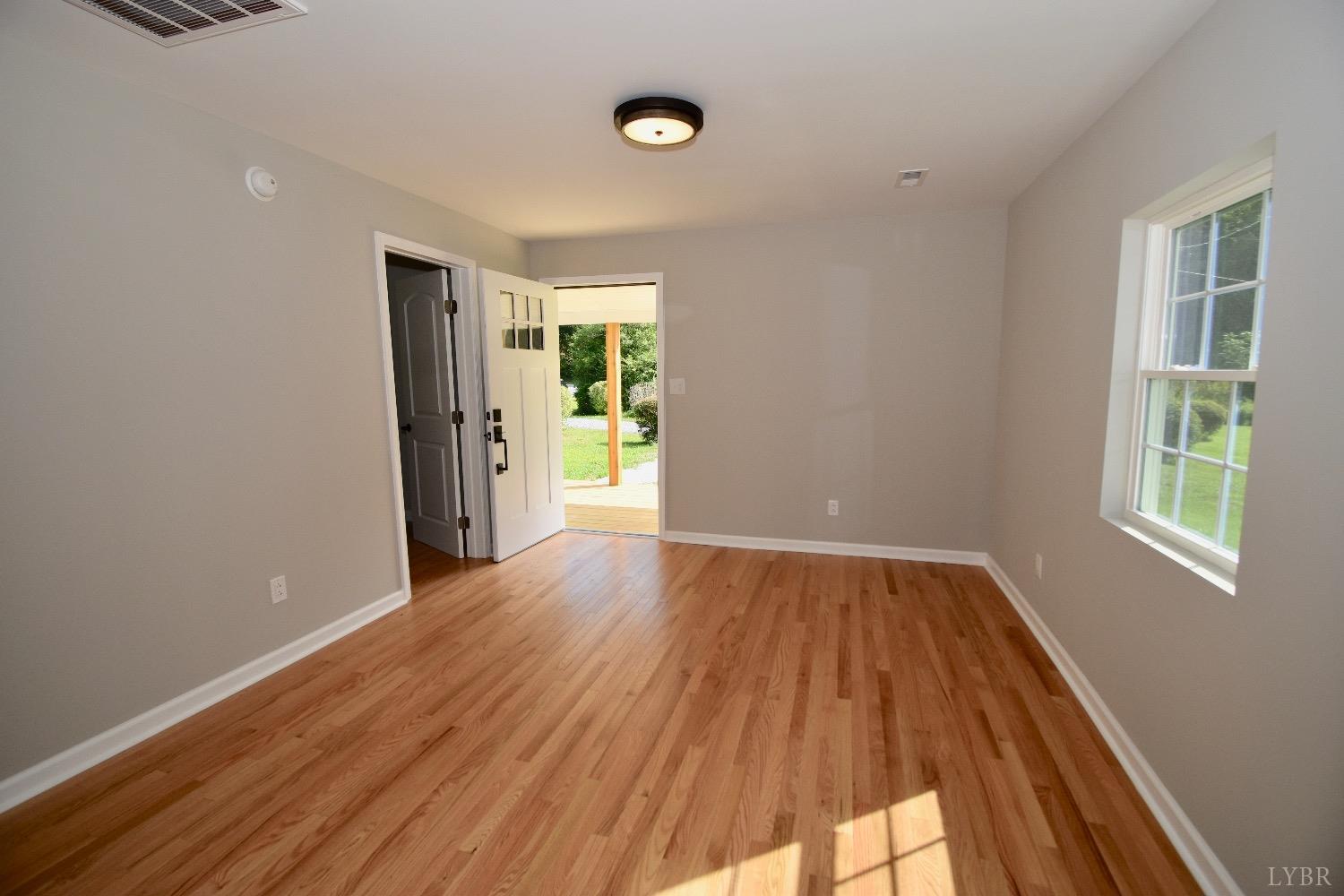 30 Sawmill Road Concord, VA 24538 - Photo 20 of 34 a view of an empty room with window and wooden floor