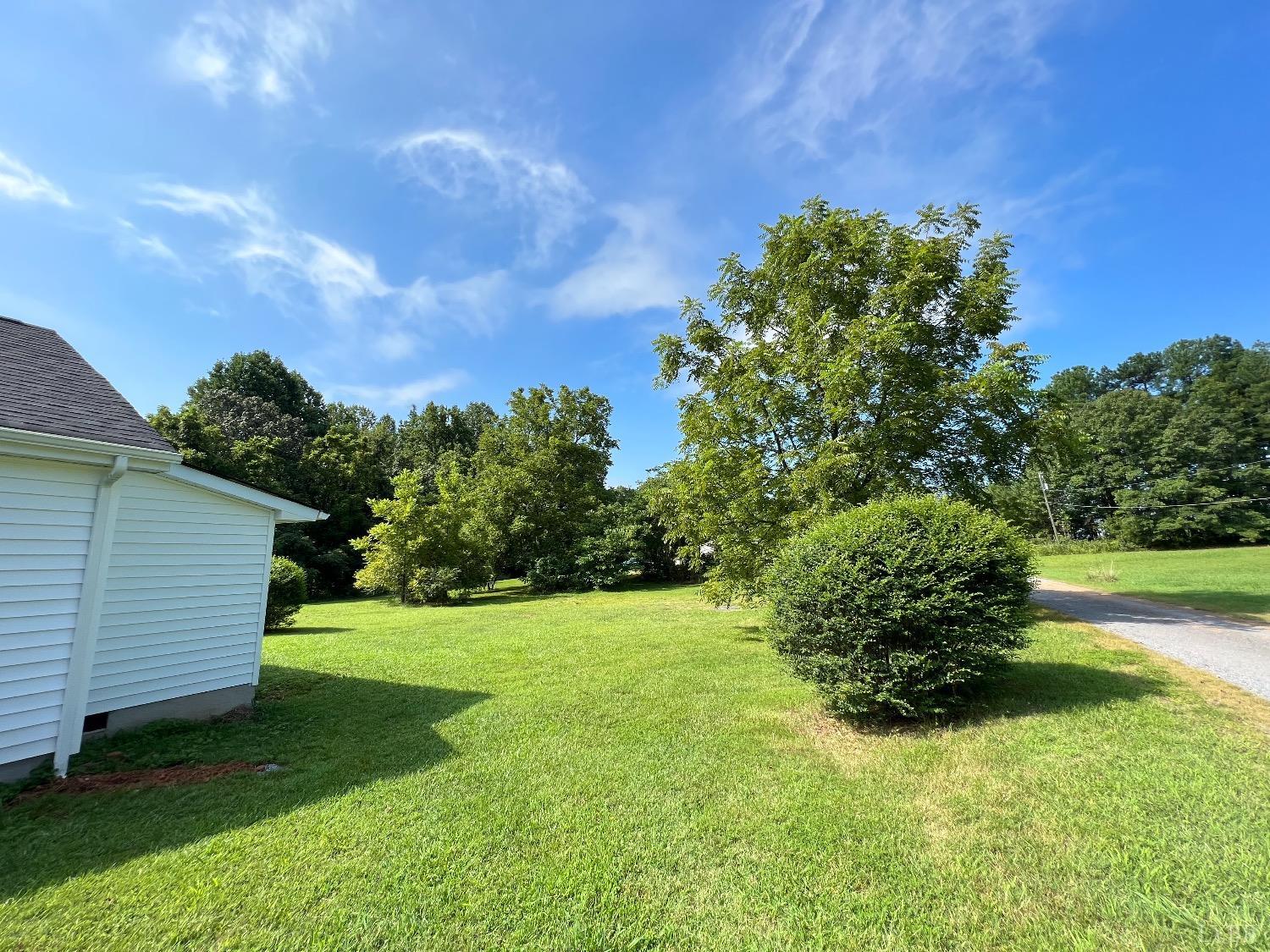 30 Sawmill Road Concord, VA 24538 - Photo 27 of 34 a view of a backyard with plants and a large tree