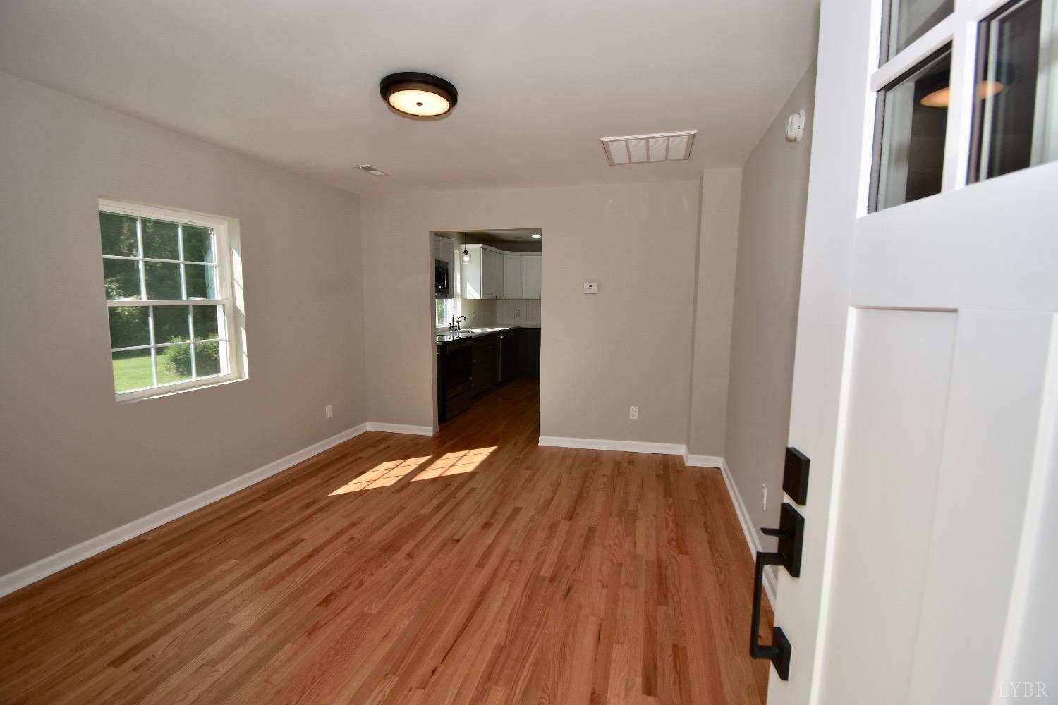 30 Sawmill Road Concord, VA 24538 - Photo 4 of 34 a view of an empty room with window and wooden floor