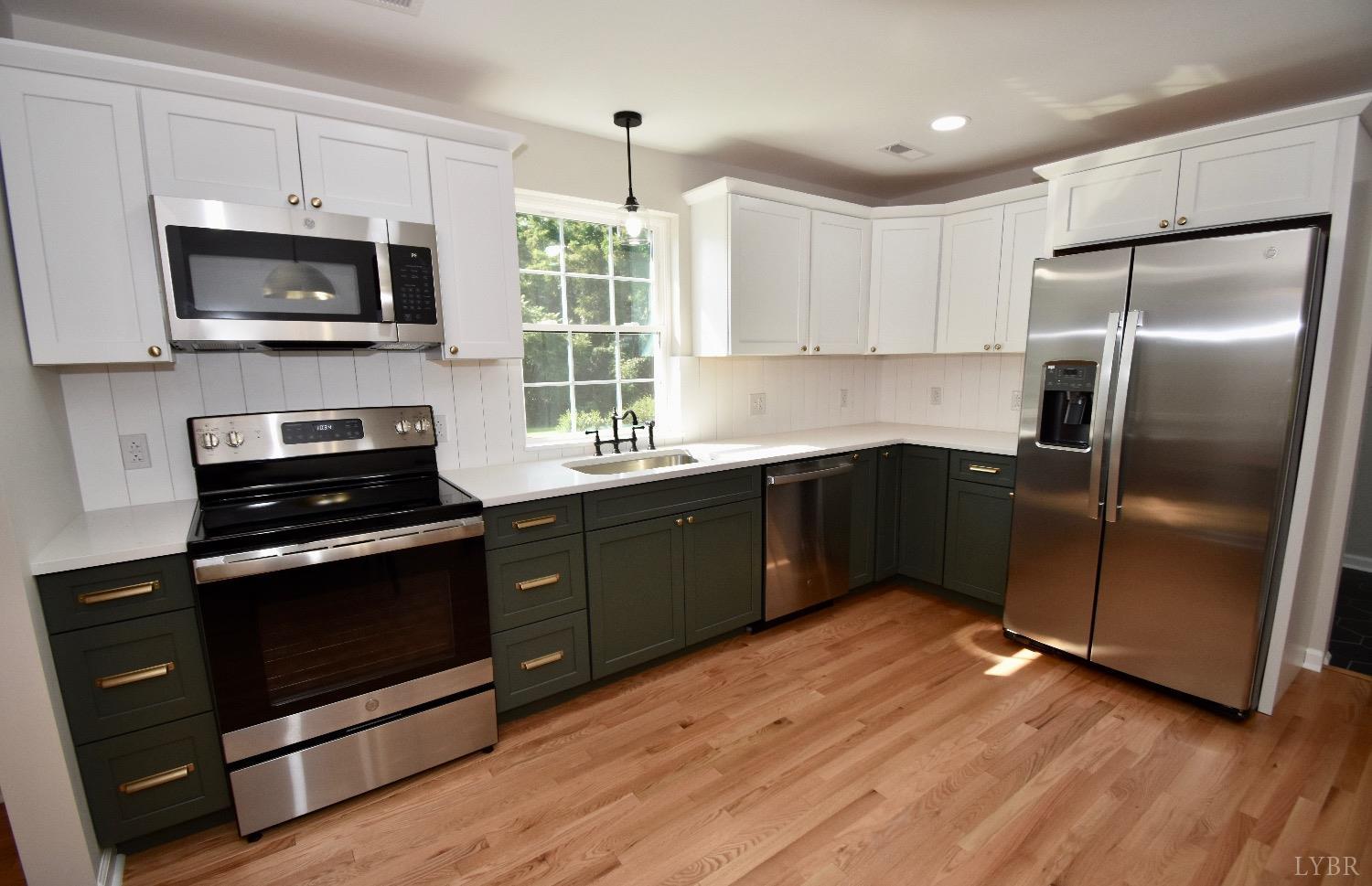 30 Sawmill Road Concord, VA 24538 - Photo 6 of 34 a kitchen with stainless steel appliances granite countertop a sink stove and refrigerator