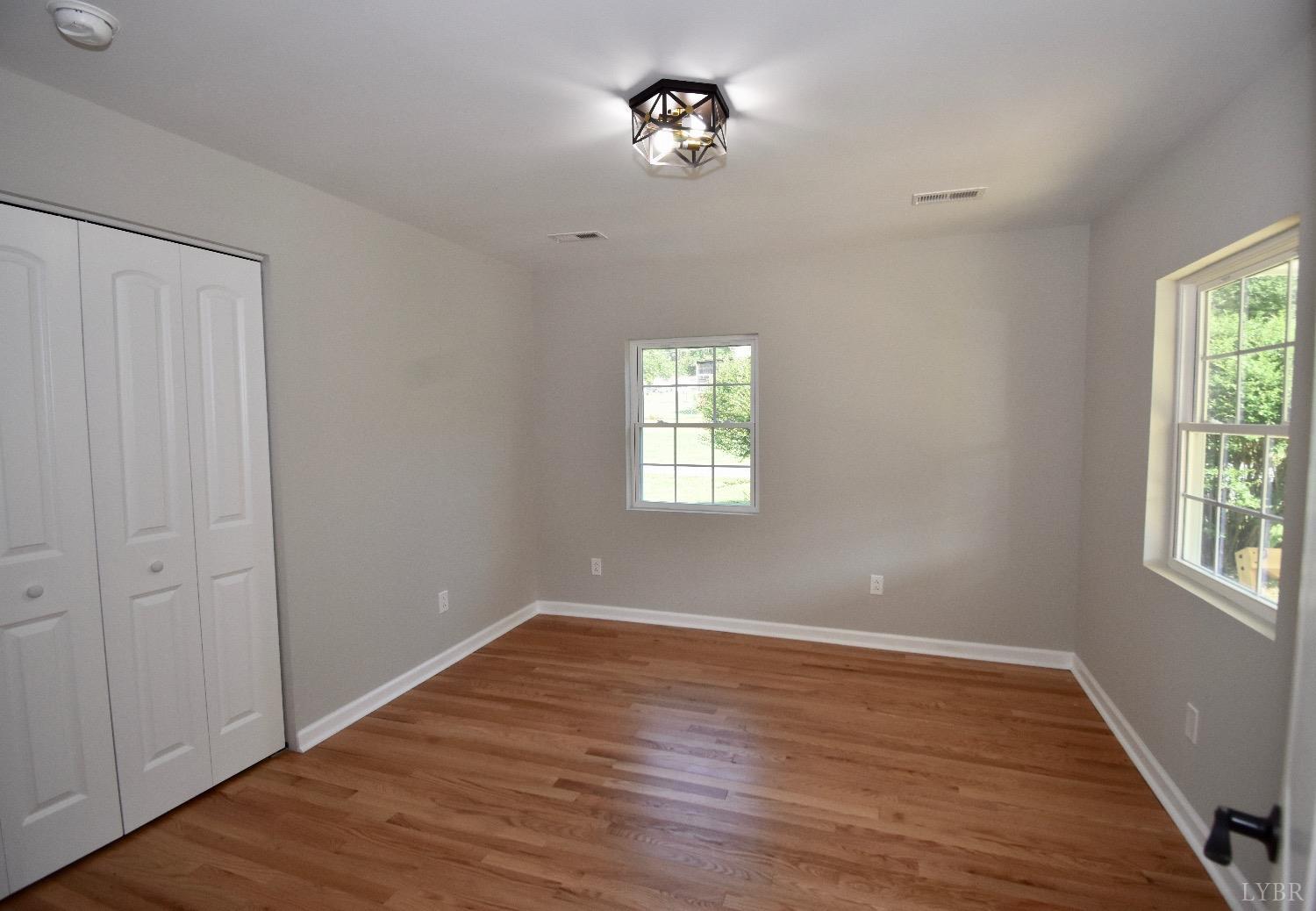30 Sawmill Road Concord, VA 24538 - Photo 10 of 34 wooden floor in an empty room with a window