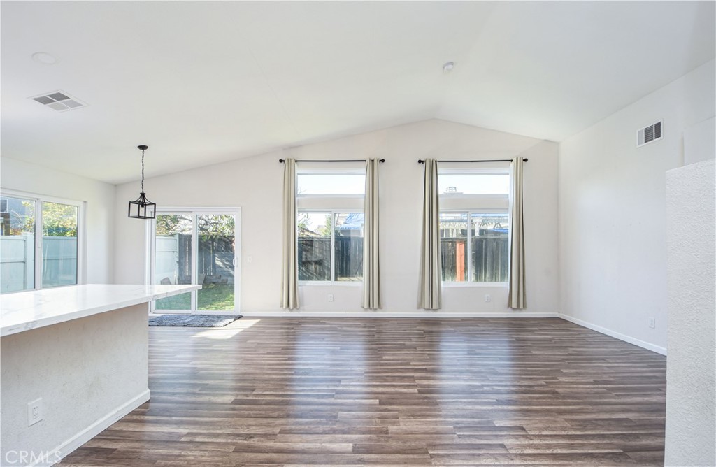 3714 Avondale Street Perris, CA 92571 - Photo 3 of 19 a view of an empty room with wooden floor and a window