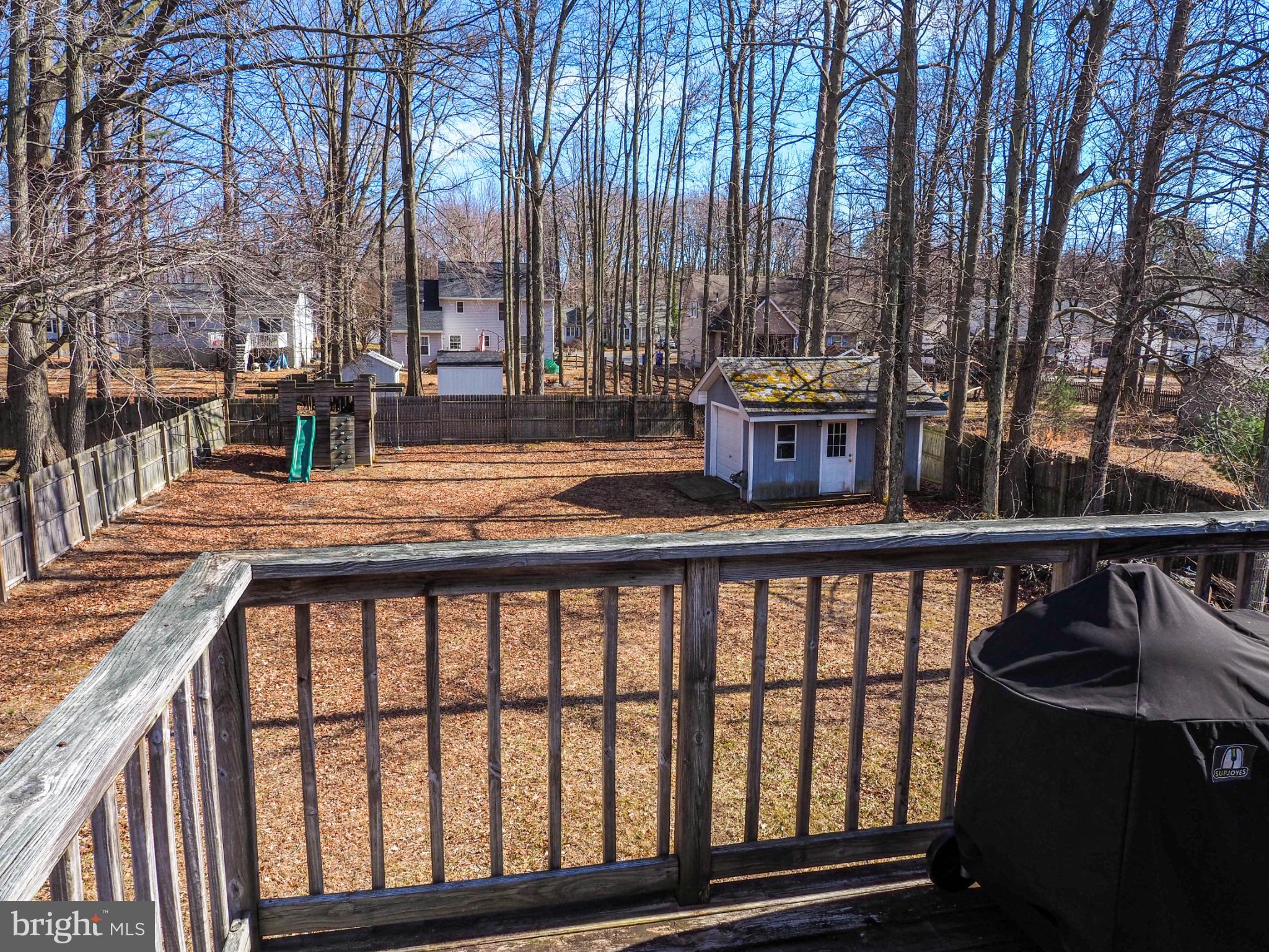 620 Old Love Point Road Stevensville, MD 21666 - Photo 26 of 45 a view of a balcony with chairs and wooden fence