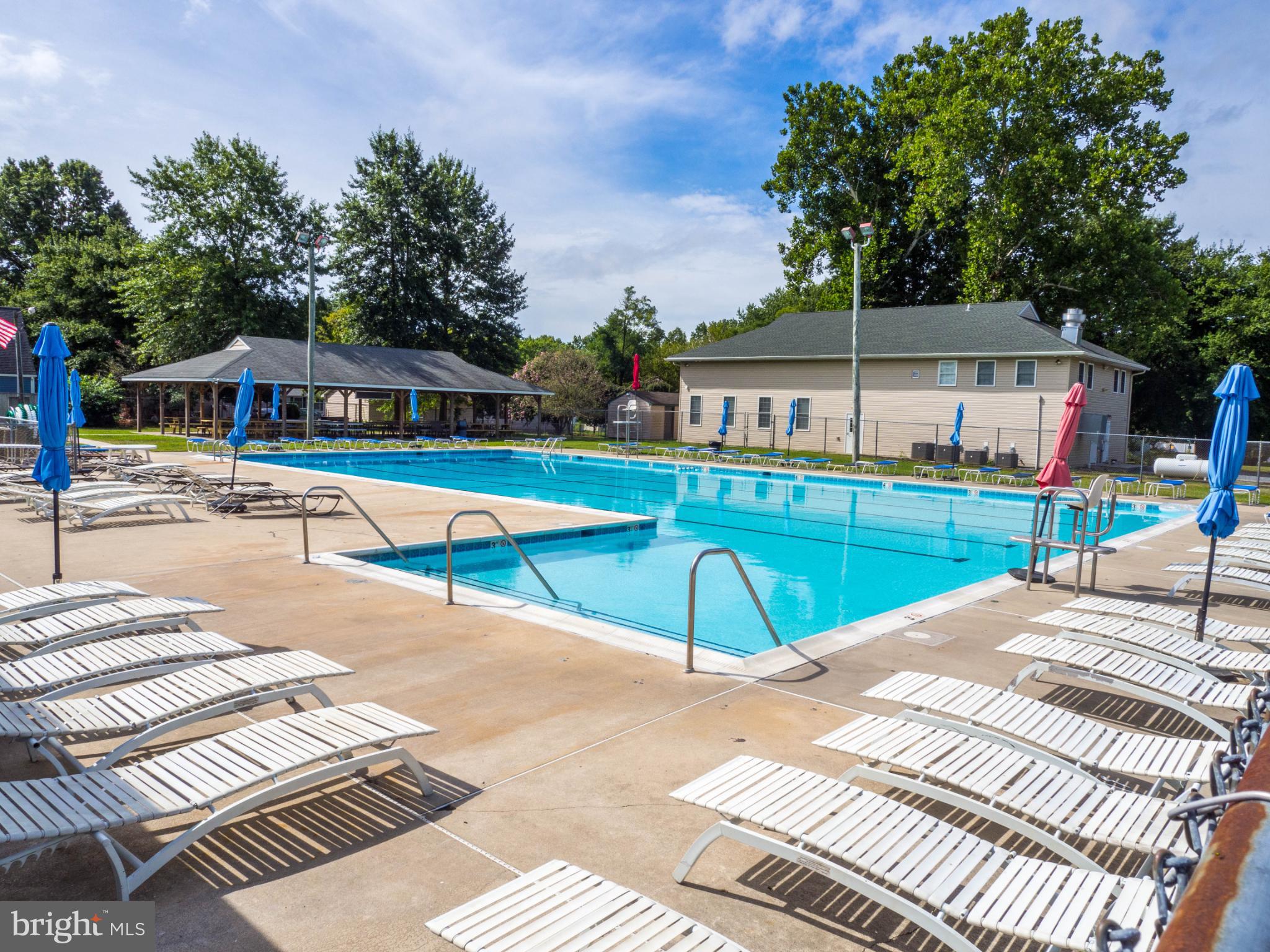 620 Old Love Point Road Stevensville, MD 21666 - Photo 37 of 45 a view of a backyard with a patio and swimming pool