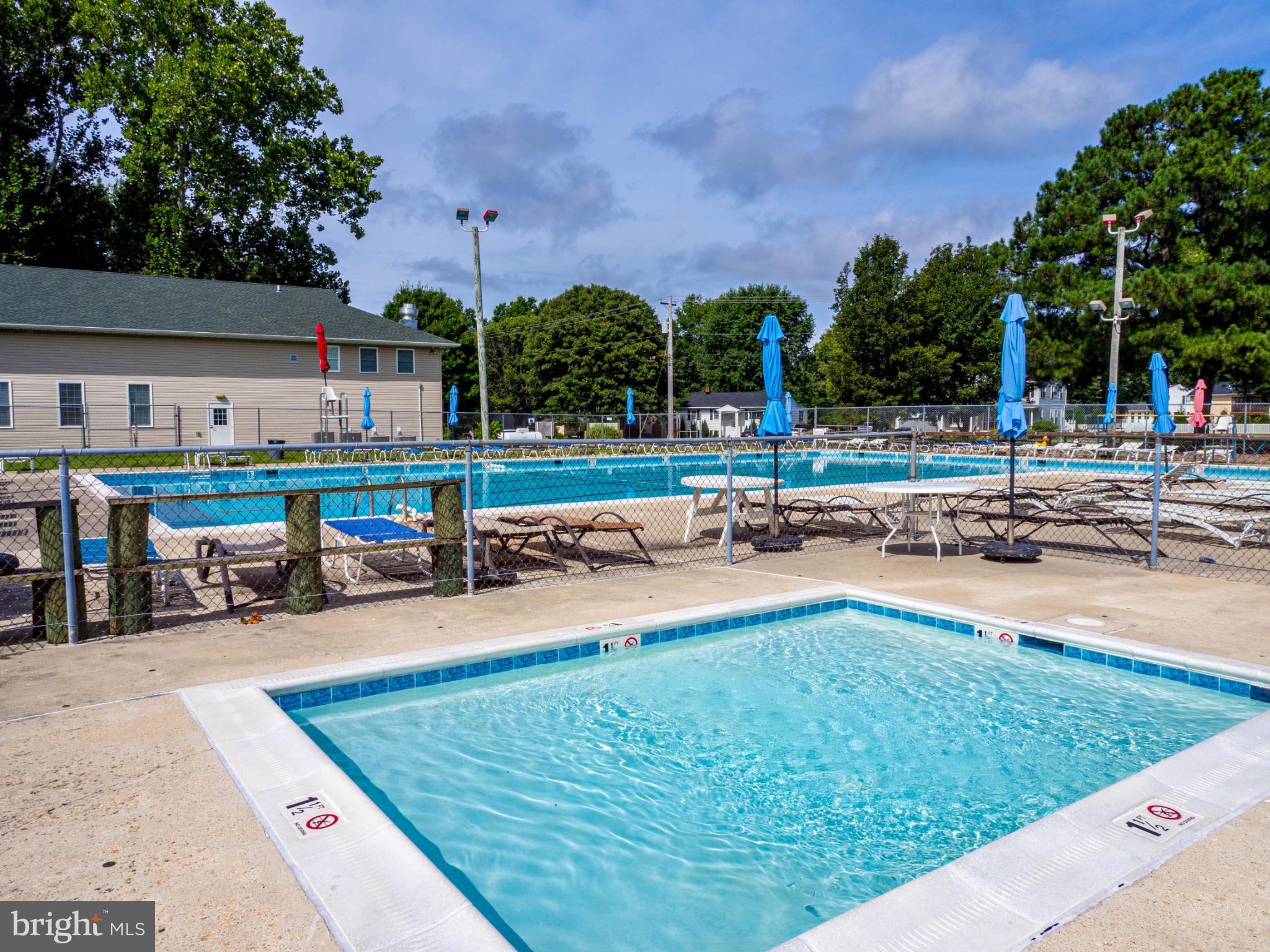 620 Old Love Point Road Stevensville, MD 21666 - Photo 39 of 45 a view of a swimming pool with a patio and a yard