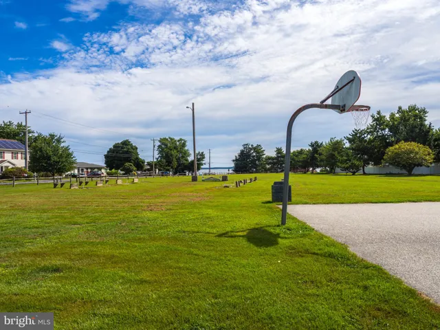 a swimming pool with outdoor seating and yard