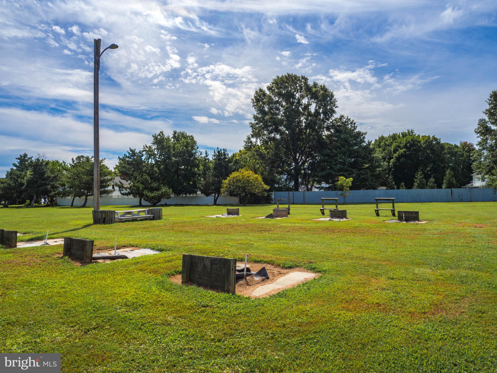 620 Old Love Point Road Stevensville, MD 21666 - Photo 44 of 45 a swimming pool with outdoor seating and yard