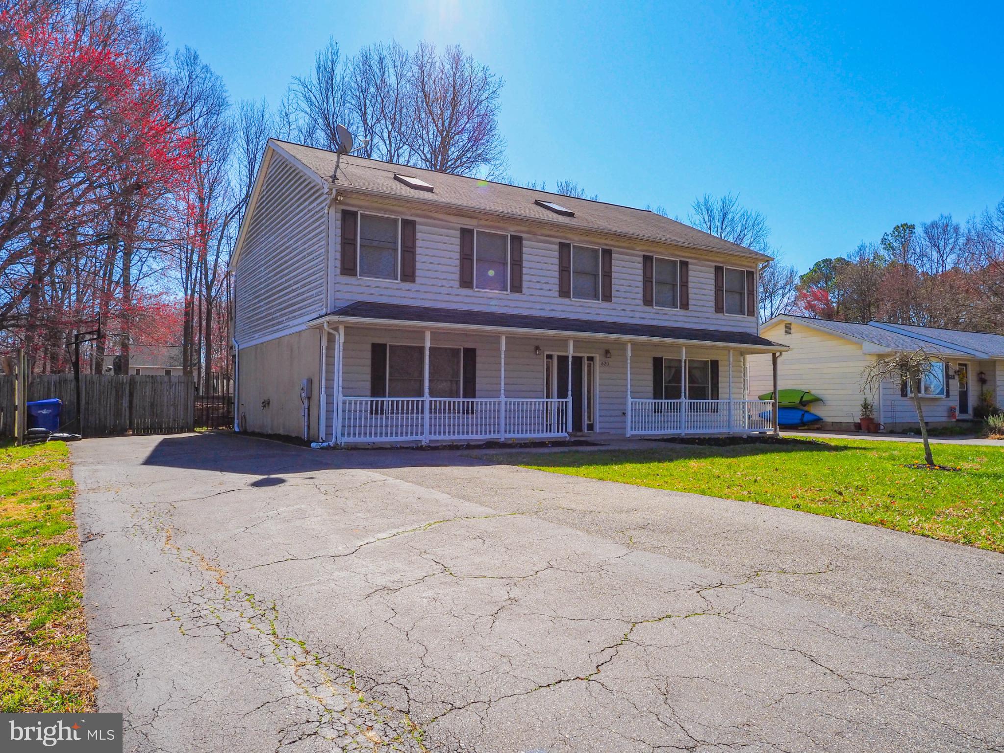 620 Old Love Point Road Stevensville, MD 21666 - Photo 5 of 45 a view of an house with swimming pool and a yard