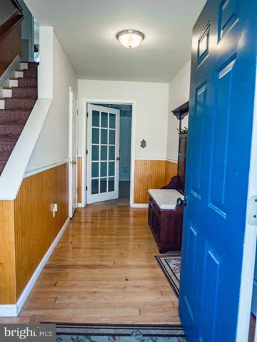 a view of an entryway with wooden floor