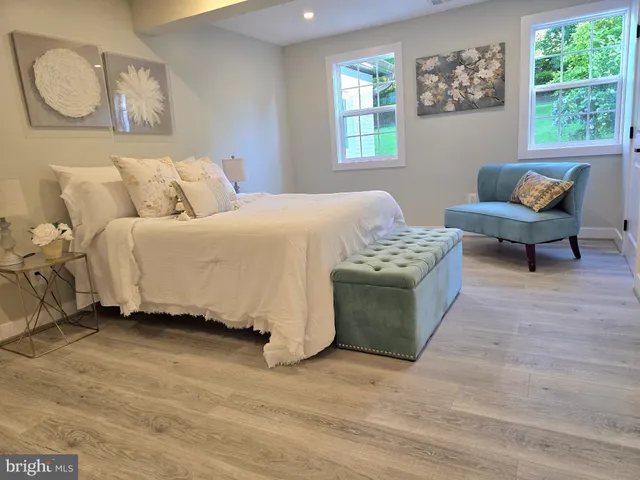 a bedroom with a bed and a couch