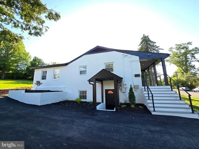 a view of a house with backyard and swimming pool