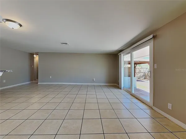 a view of an empty room and window