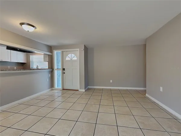 a view of an empty room and window