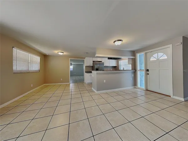 a view of a kitchen with a sink and cabinets