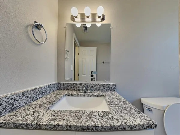 a bath room with a toilet and a bath tub