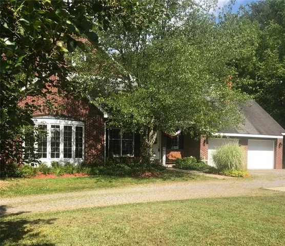 a view of a house with a swimming pool